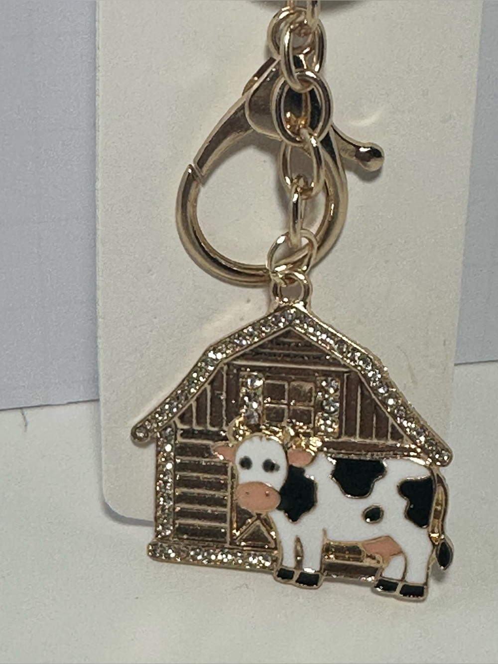 Gold-tone Cow Keychain Charm with Barn Accent